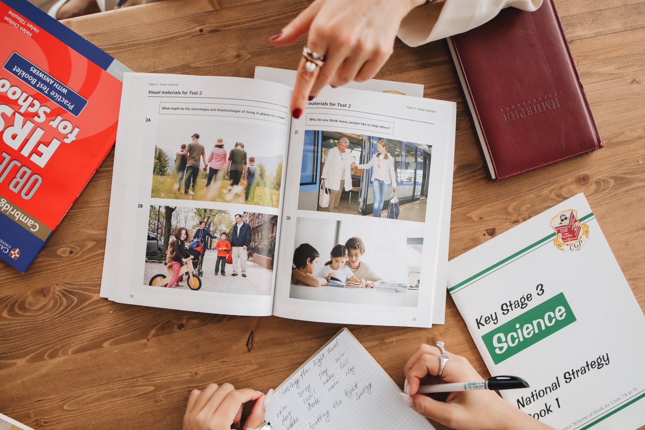 Flat lay of educational books and a notebook, ideal for learning and study concepts.